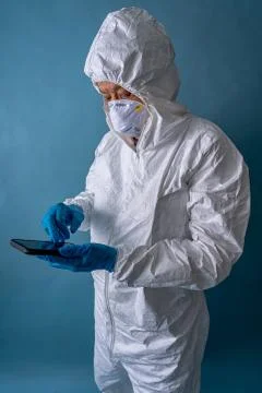 A phyisician checking his while on stand-by during the coronavirus 2020 pandemic Stock Photos