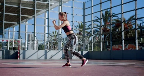 Physical activity and body movement of pretty sportive young woman outdoor urban Stock Footage 117694283