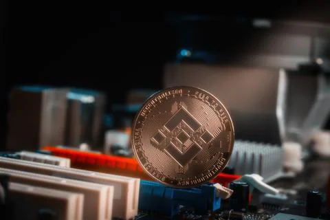 Physical Binance Coin BNB on Computer Motherboard Circuit Board Stock Photos