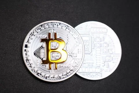 Physical Bitcoin on a black textured background. Stock Illustration
