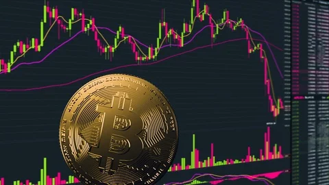 Physical coin Bitcoin on a price chart Stock Footage