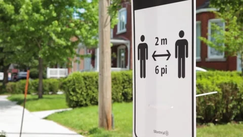Physical Distancing Sign on SideWalk in Montreal, Quebec Canada Stock Footage