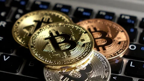 Physical metal Bitcoins on computer keyboard, CU rotation Stock Footage 83381805