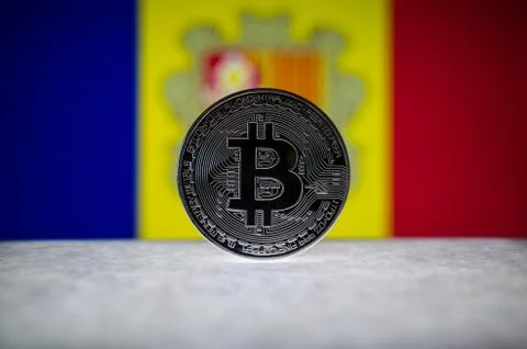 Physical silver version of Bitcoin (BTC) and Andorra Flag on the background Stock Photos