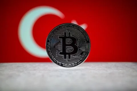 Physical silver version of Bitcoin BTC and Turkey Flag on the background Stock Photos