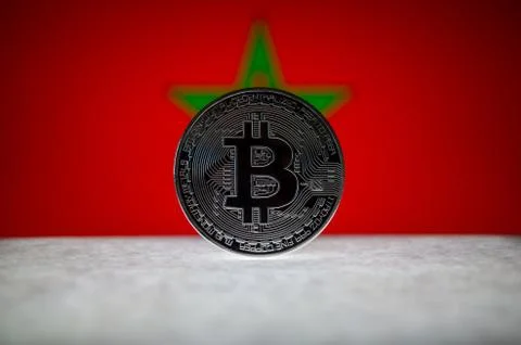 Physical silver version of Bitcoin BTC and Morocco Flag on the background Stock Photos