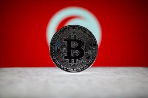 Physical silver version of Bitcoin BTC and Tunisia Flag on the background Stock Photos