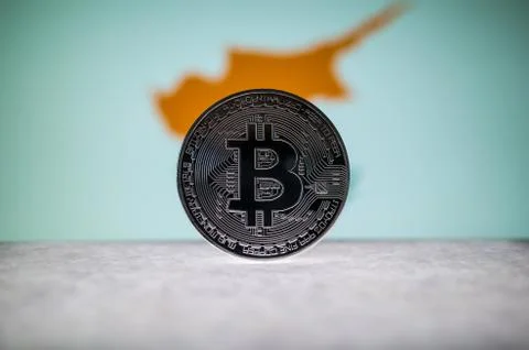 Physical silver version of Bitcoin BTC and Cyprus Flag on the background Stock Photos