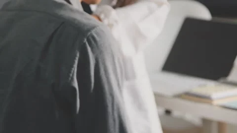 Physical therapist performs shoulder range of motion test on male patient Stock Footage 343708571