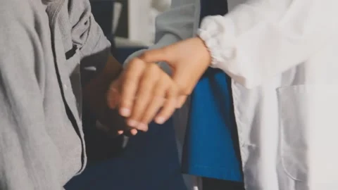 Physical therapist performs shoulder range of motion test on male patient Stock Footage 343708577