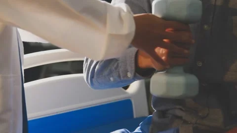 Physical therapist performs shoulder range of motion test on male patient Stock Footage 343708965