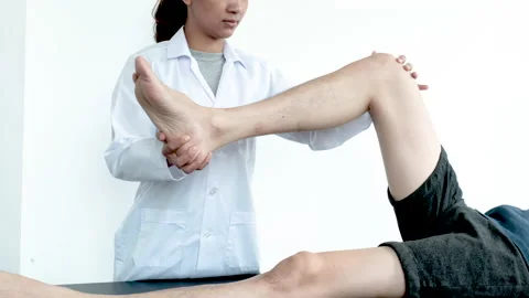 Physical therapy is doing leg therapy for patients in the hospital Stock Footage 146106117