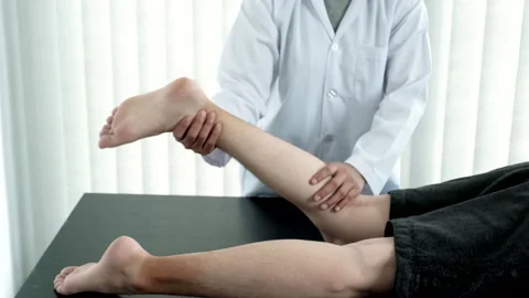 Physical therapy is doing leg therapy for patients in the hospital Stock Footage 146106156