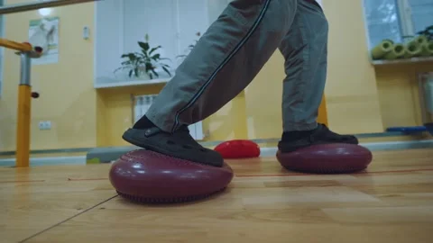 Physical therapy, training on uneven bars after injury Stock Footage 225622967