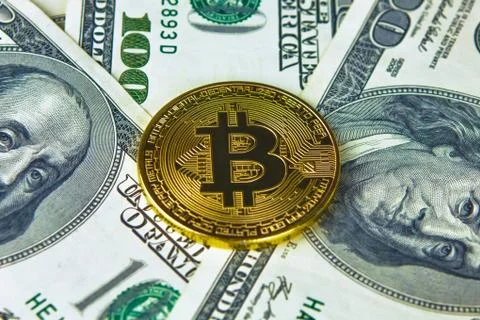 Physical version of Bitcoin new virtual money and banknotes of dollars. Stock Photos