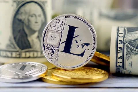 Physical version of Litecoin (new virtual money) and banknotes of one dolla.. Stock Photos