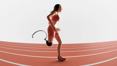 Physically challenged female athlete with prosthetic leg runs on a track Video stock 84593754