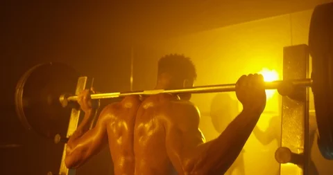 Physically fit doing heavy weight exercise with barbell Stock Footage 116359562