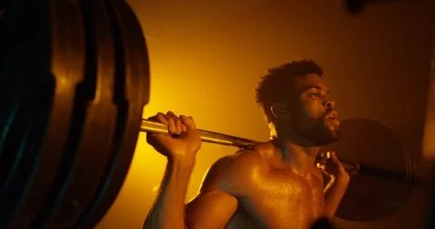 Physically fit doing heavy weight exercise with barbell Stock Footage 116360747