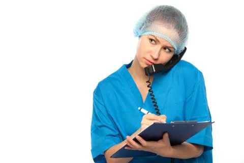 Physician does record in pad Stock Photos