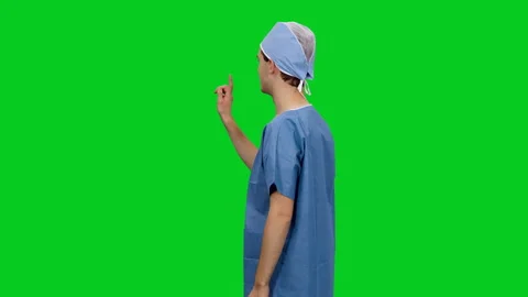 Physician doing hand gestures while using virtual display, chroma key Vídeo Stock 126340806