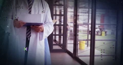 Physician flipping pages in corridor causing digital glitch elements orbiting Stock Footage 310318854