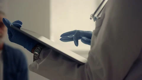 Physician hands holding pad computer checking patient data in hospital close up. Stock Footage 194475495