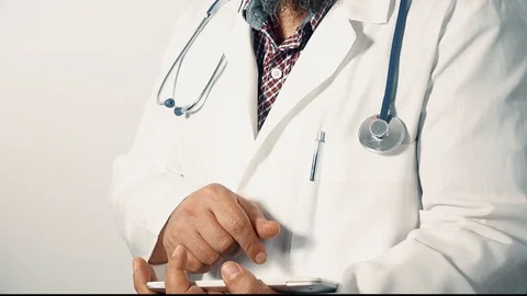 Physician holding a digital tablet looking at the camera zoom out Stock Footage 112395887