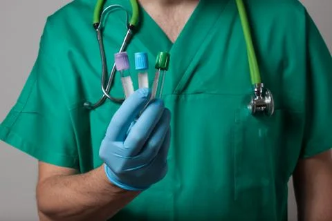 Physician holding test tubes Stock Photos
