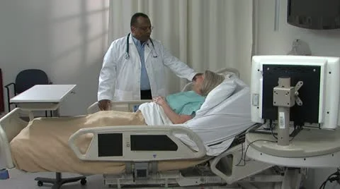 Physician informs patients at Bedside a Stock Footage 11140228