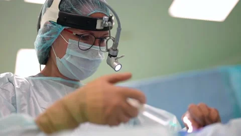 Physician is infusing medicament to patient on operating table, anesthesia and 스톡 동영상 167275448