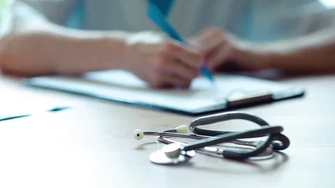 Physician note on empty RX paperwork in hospital/ clinic office interior Video stock 69157455