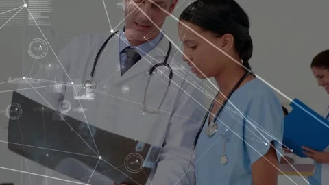 Physician pointing chart, nurse checking device, medical HUD marking imaging Stock Footage 333903017
