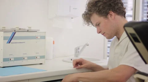 Physician preparing syringe to place injection Stock Footage 41384447