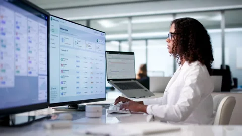 Physician Reviews Clinical Notes On Computer, Ensuring Accurate Diagnosis Stock Footage 341012177