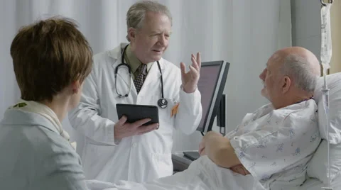 Physician showing regret while talking to his hospital patient Stock-Footage 62470552