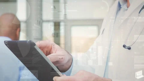 Physician tapping tablet and zooming digital chart for patient data review in Stock Footage 311216624