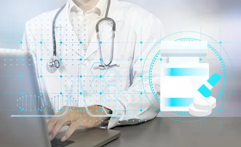 Physicians oversee the safe administration of medications to their patients.. Stock Photos