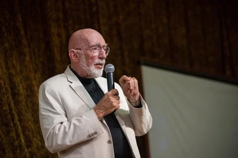Physicist Kip Thorne delivering a lecture on stage during the STARMUS VI festiva Stock Photos