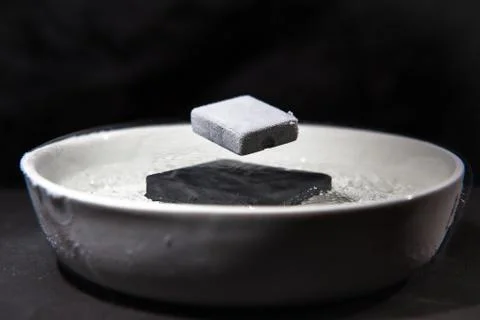 Physics in action - experiment with supraconductive materials Stock Illustration