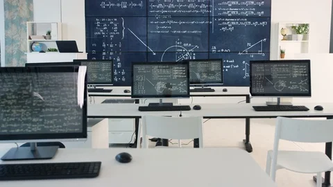Physics formula on computer screens and blackboard in empty classroom Stock Footage 106678620