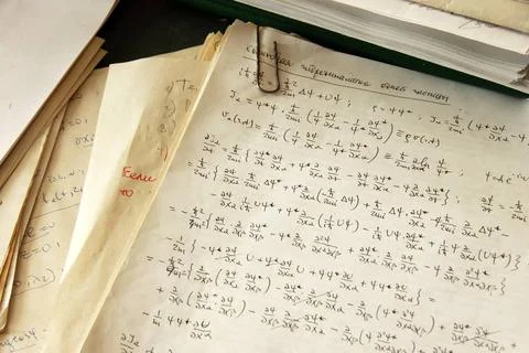Physics formulas physics formulas and calculations written on paper, quant... Stock Photos