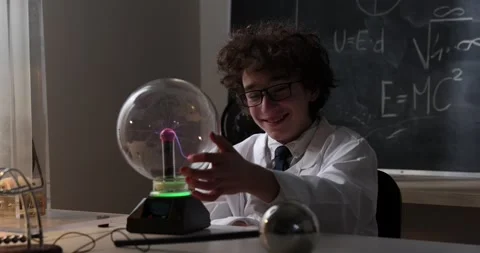 Physics science lab: handsome young scientist in white coat and glasses doing Stock Footage 172199994