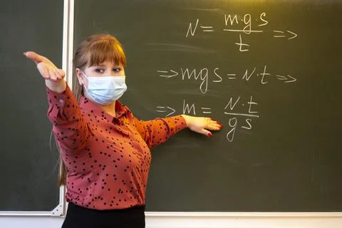 A physics teacher conducts a survey using formulas. Stock Photos