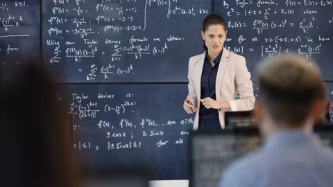 Physics teacher giving a lecture in class Stock Footage 106670961