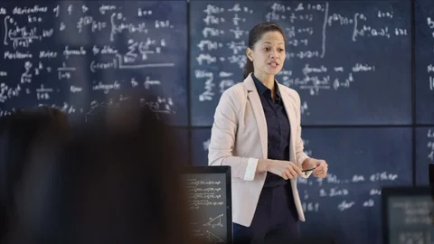Physics teacher giving a lecture in class Stock Footage 106671186
