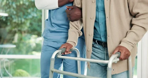 Physio, hands and help man with walker for exercise, movement and injury 스톡 동영상 341567490