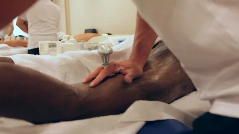 Physiotherapist applying massage Stock Footage 91690915