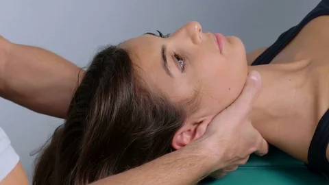 Physiotherapist checking patient's neck Stock Footage