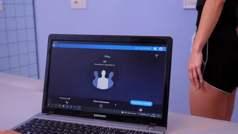 Physiotherapist checking a patient's software measurement Stock Footage 167385670